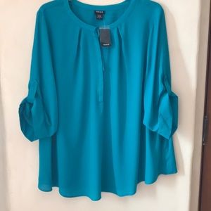 Torrid blouse in a a turquoise color size 4x